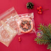Целофановий пакетик «We wish a Merry Christmas/Різдвяний вінок» з клейкою стрічкою, 10*10 cм + 3 см