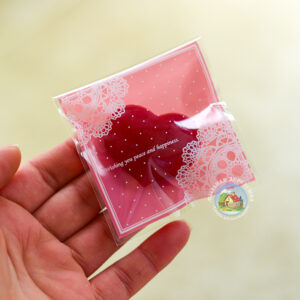 Целофановий міні пакетик «Wishing you peace and happiness» рожевий з клейкою стрічкою, 7*7 cм + 3 см